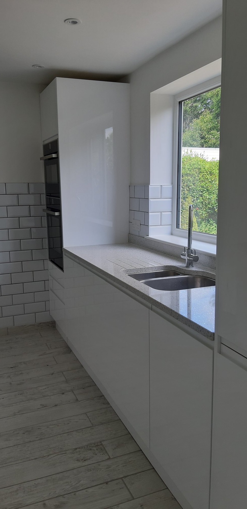 Modern white kitchen with subway tiles
