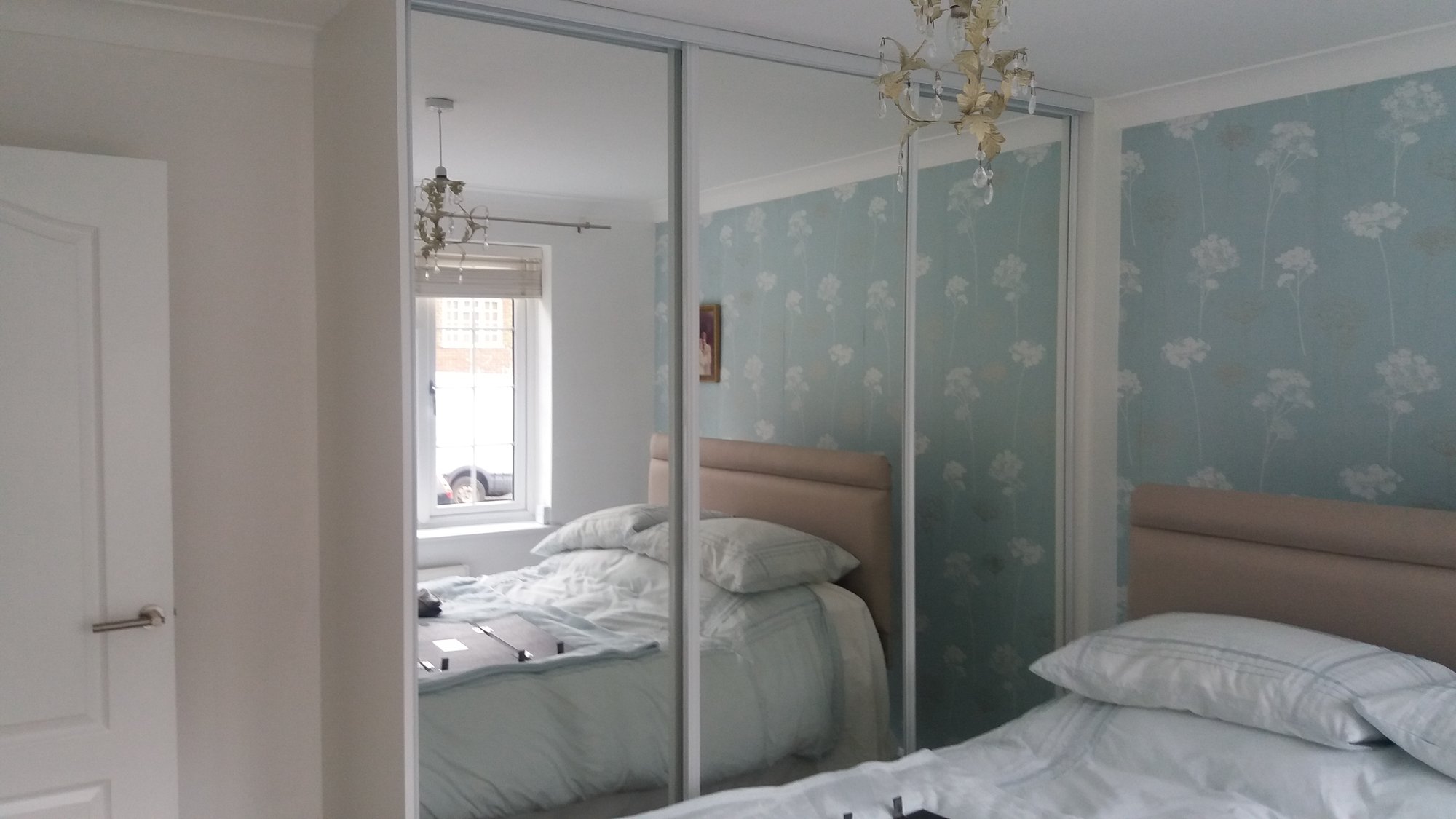 Full length mirror wardrobes in bedroom