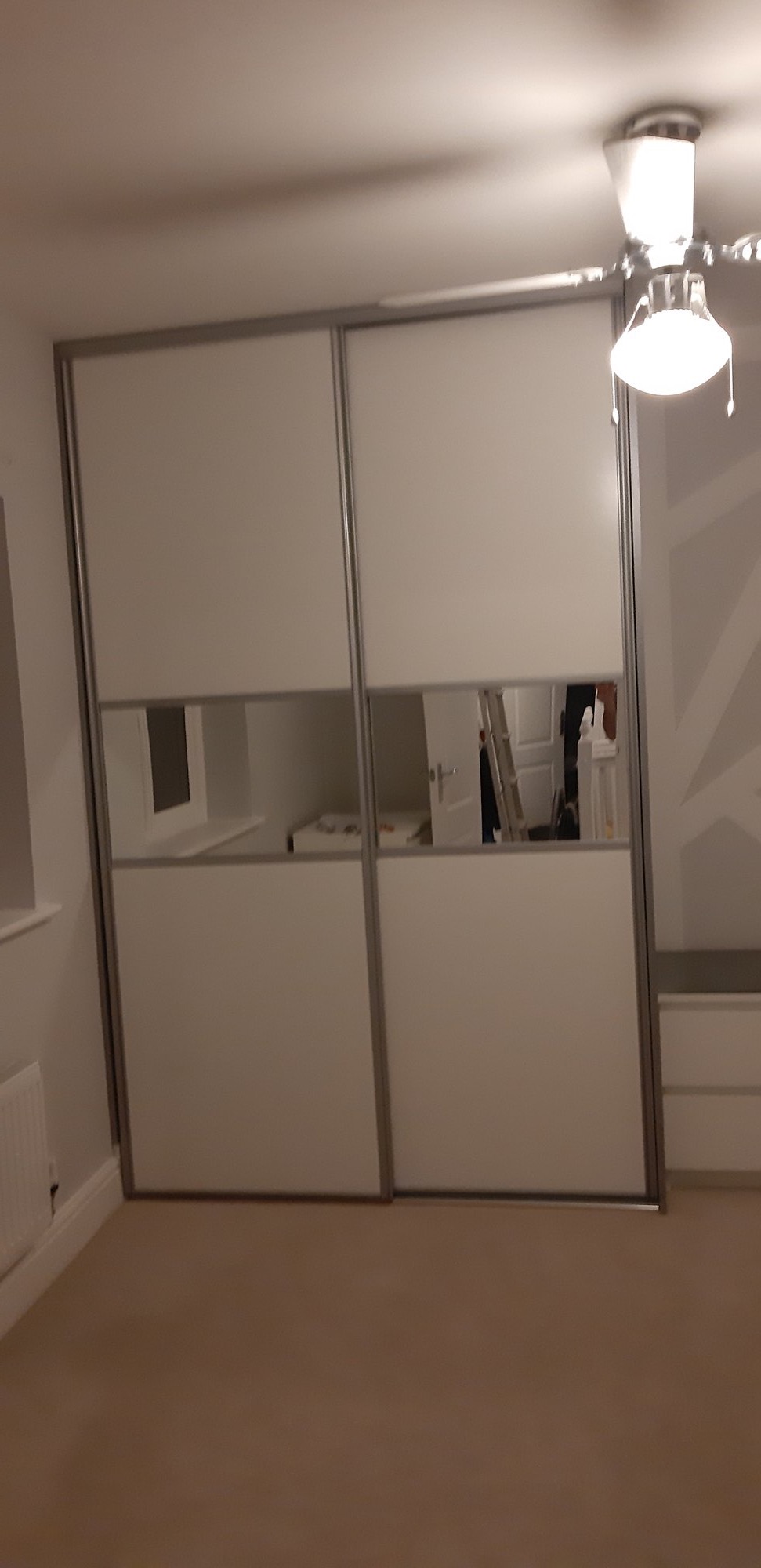 Fitted sliding wardrobes with mirror panels